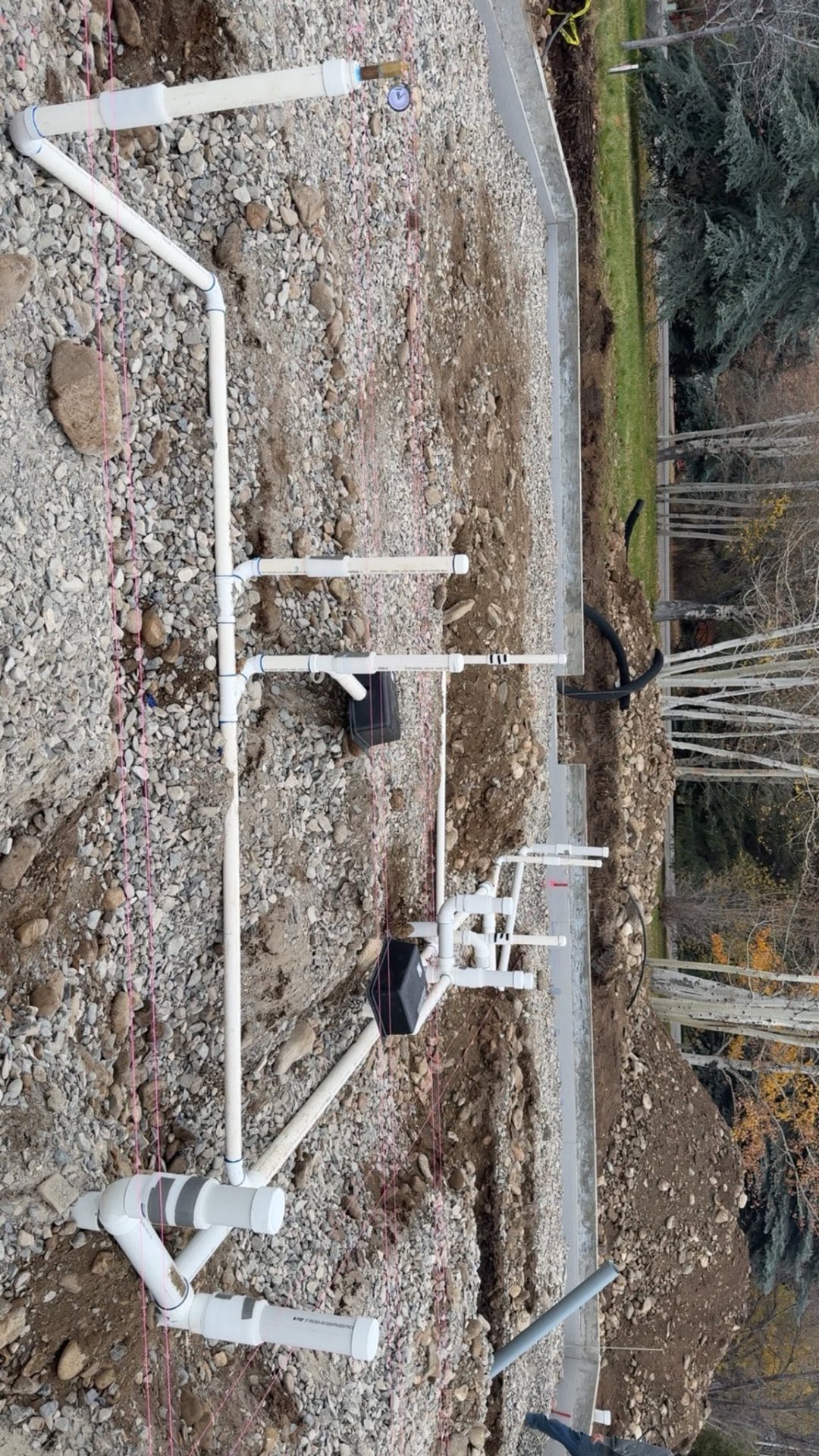 Underground site plumbing manifold and service stub-outs